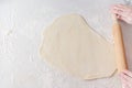 ÃÂ¡ook rolls out the dough with rolling pin on white background. Royalty Free Stock Photo